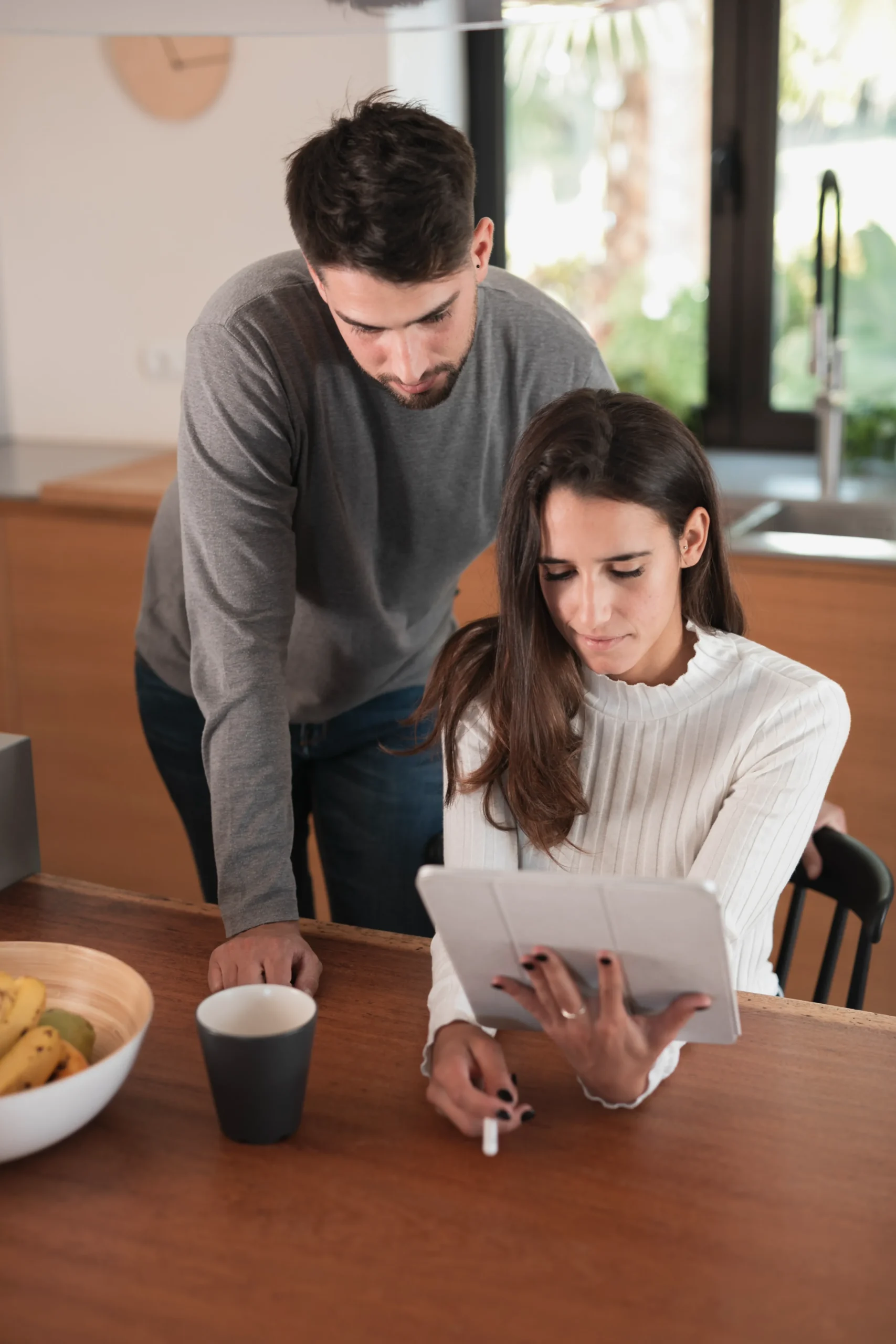 Couple reviewing digital sexual health information and STI testing options online with HerMister telehealth platform.