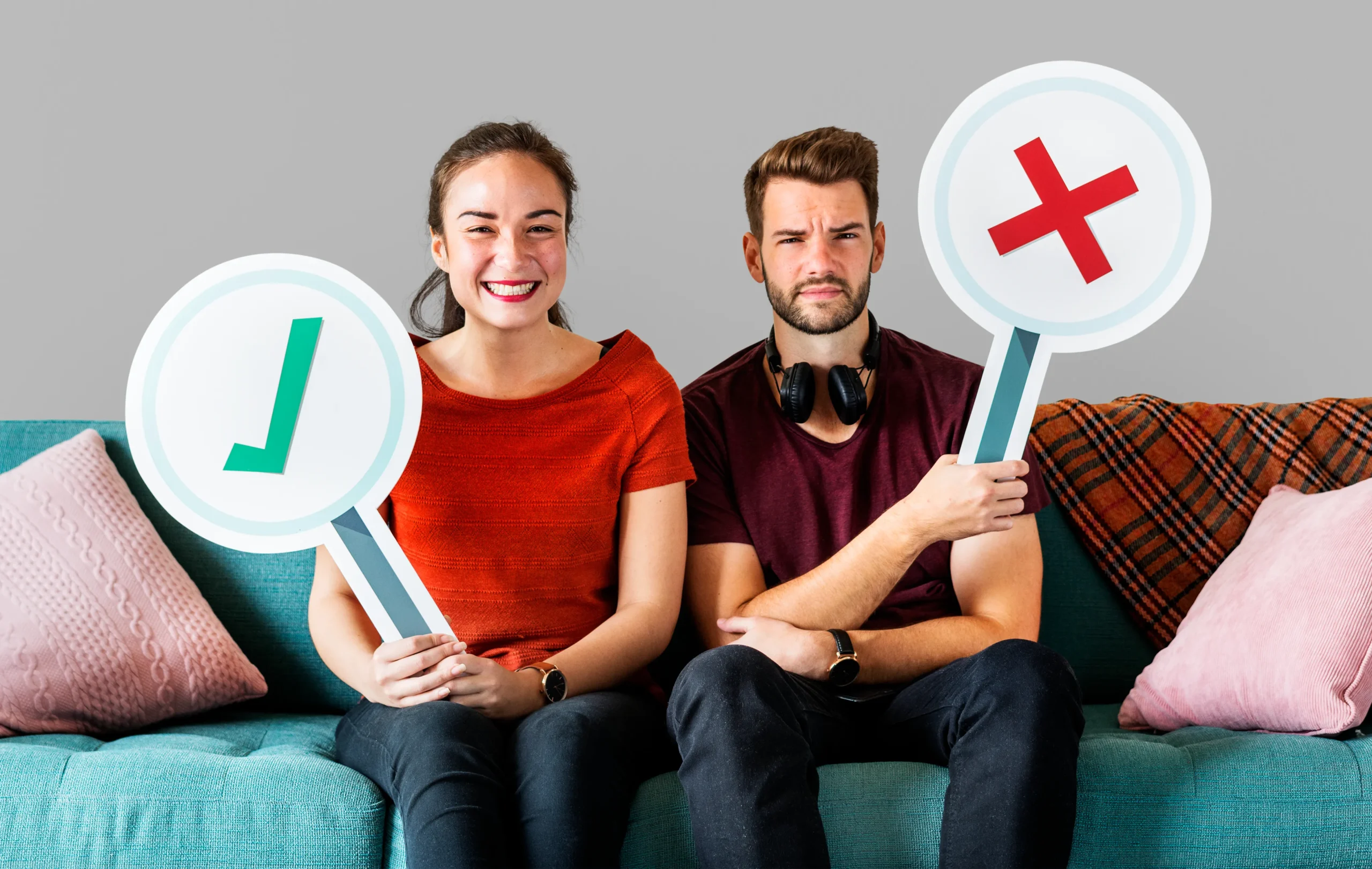 A woman and a man on a couch holding up checkmark and cross signs, representing true facts versus misinformation regarding confidential PrEP access.