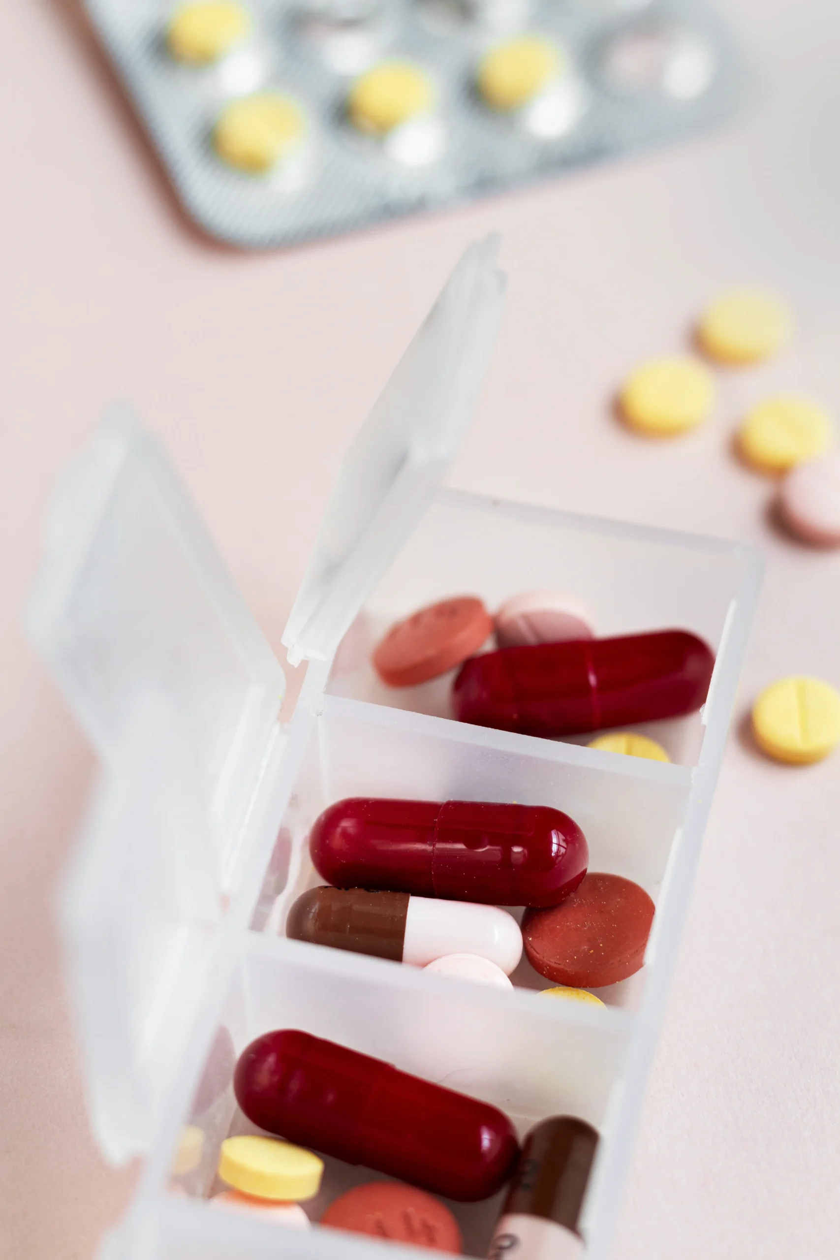 A weekly pill organizer filled with medication to manage a daily PrEP regimen for HIV protection.