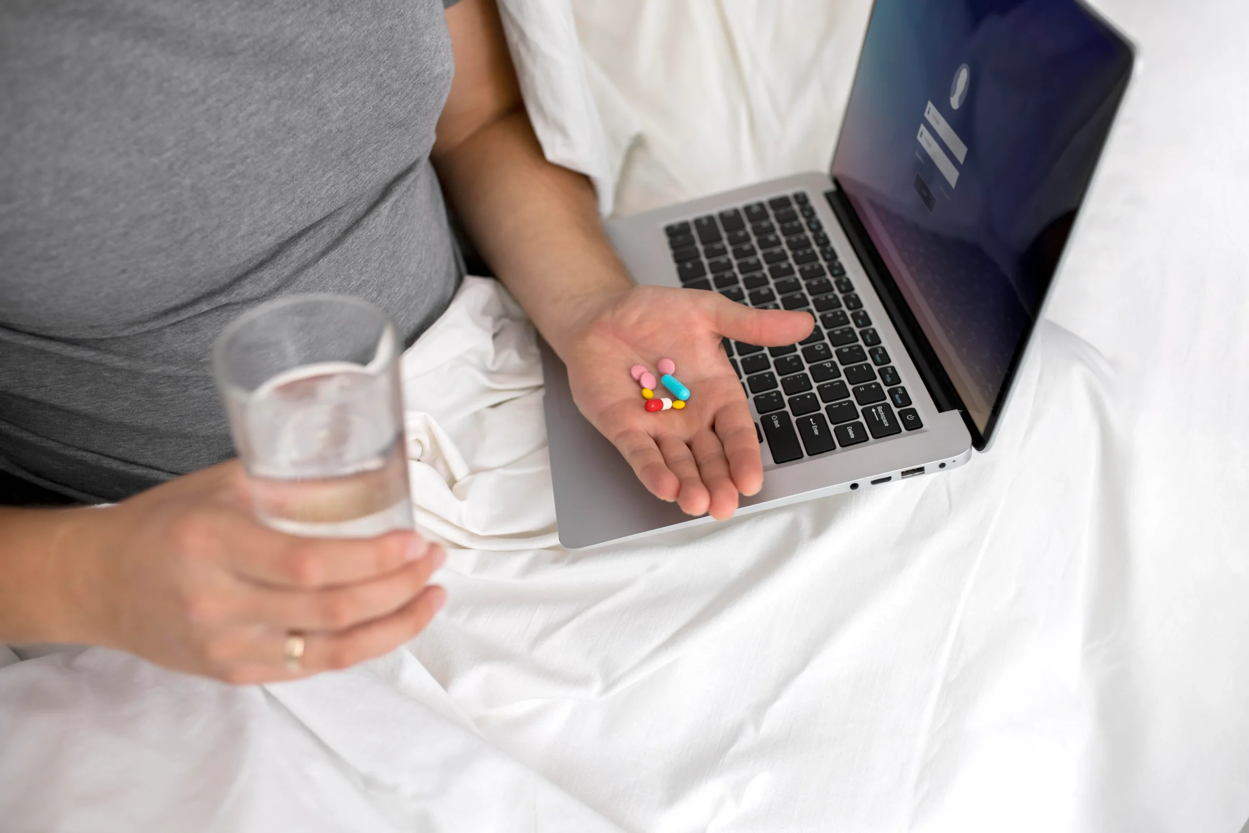 Patient holding oral medication delivered directly to their home through a PrEP home delivery service.