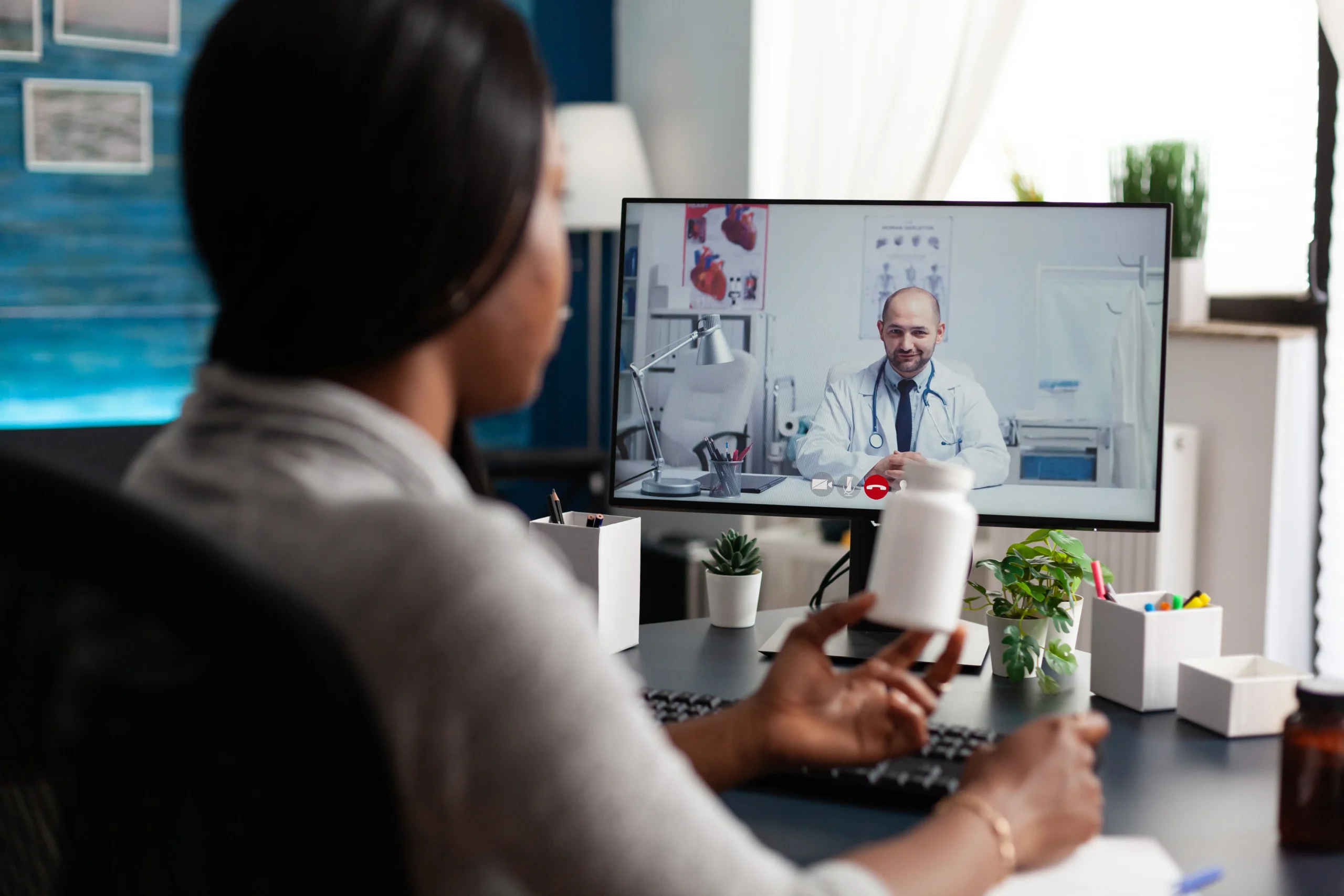 Patient having a video consultation with a doctor for virtual STI treatment.