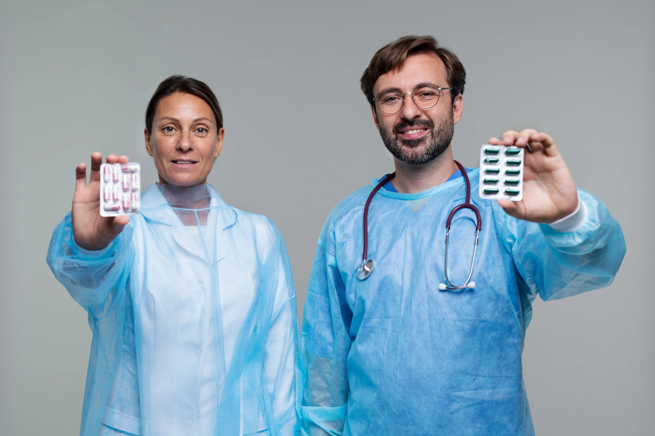Doctors presenting prescription medication packs for comprehensive STI prevention options.